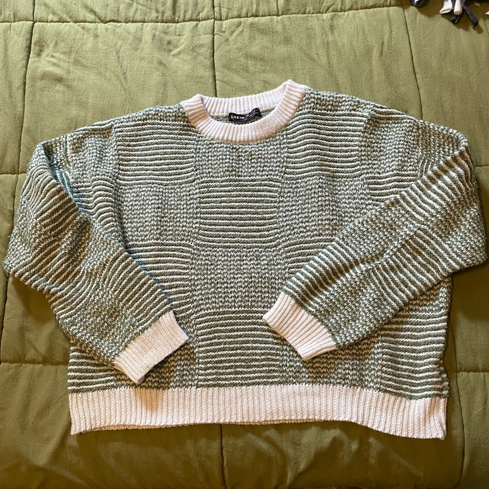 Green and white knit sweater